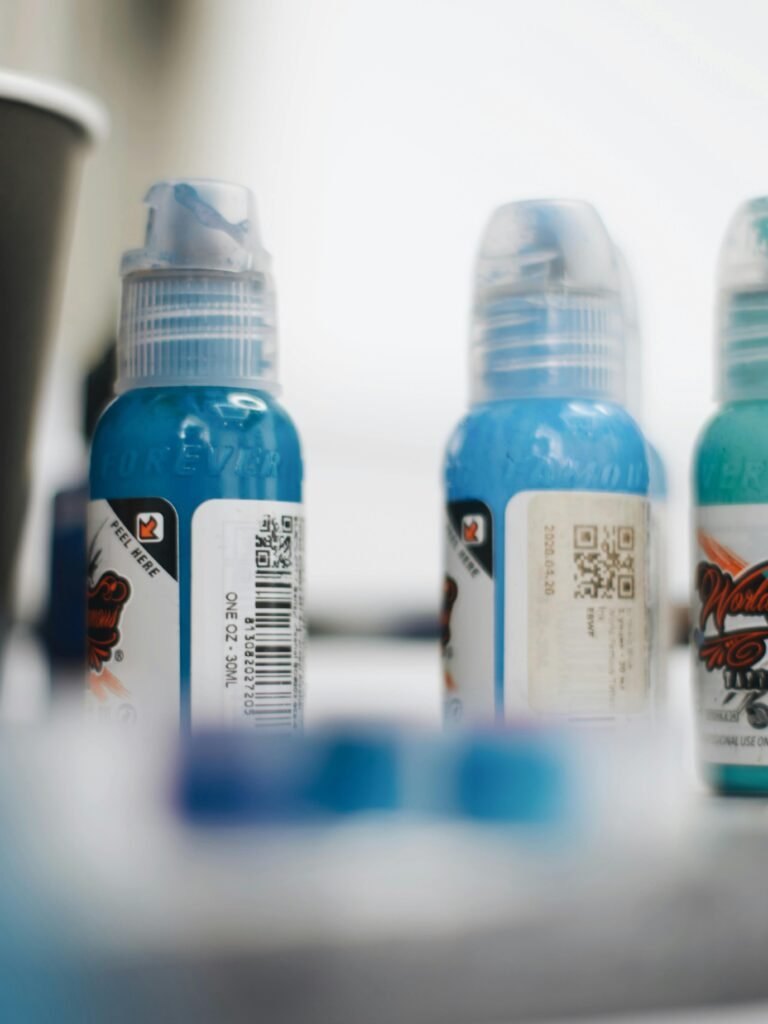 Detailed view of blue bottles with labels, perfect for product displays.